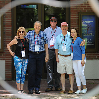 Photo of five people smiling